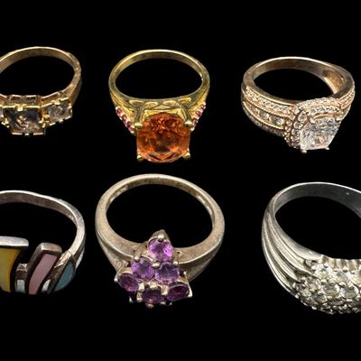 Sale Photo Thumbnail #538: Includes colored moonstone, amethyst, CZ, and more. Total of six rings. Some have a 14K gold vermeil wash. The total weight is 29.81 grams. [GG]