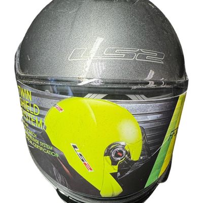 Sale Photo Thumbnail #559: Includes a pair of LS2 helmets, and an Arai helmet with built-in communication/microphone. The LS2 helmets include dust covers. The LS2 helmets are sizes Small and XXXL. The Arai helmet is a size Large. Not tested. [AG]