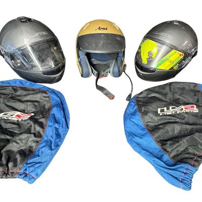 Sale Photo Thumbnail #554: Includes a pair of LS2 helmets, and an Arai helmet with built-in communication/microphone. The LS2 helmets include dust covers. The LS2 helmets are sizes Small and XXXL. The Arai helmet is a size Large. Not tested. [AG]