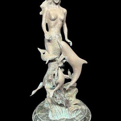Sale Photo Thumbnail #561: This was most likely created by using traditional methods like the lost-wax technique. This piece is mounted on a multi-tiered green marble base. There is some surface discoloration, and it may have been outdoors at one time. Measurement: 21.5”H. [AG]