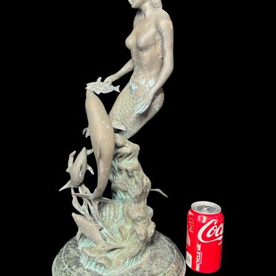 Sale Photo Thumbnail #563: This was most likely created by using traditional methods like the lost-wax technique. This piece is mounted on a multi-tiered green marble base. There is some surface discoloration, and it may have been outdoors at one time. Measurement: 21.5”H. [AG]