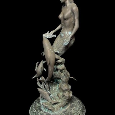 Sale Photo Thumbnail #562: This was most likely created by using traditional methods like the lost-wax technique. This piece is mounted on a multi-tiered green marble base. There is some surface discoloration, and it may have been outdoors at one time. Measurement: 21.5”H. [AG]