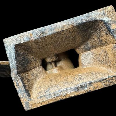 Sale Photo Thumbnail #571: This piece features a cast mermaid with outstretched arms on a heavy base. There is minimal surface rust. Measurement: 9” x 6.5”. [AG]