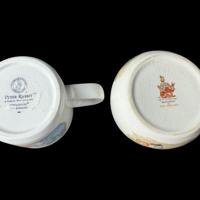 Sale Photo Thumbnail #575: Includes a vintage Wedgwood Peter Rabbit mug from Beatrix Potter’s famous illustrations, and a Royal Doulton Bunnykins mug in the Albion shape. There is minimal crazing to the Wedgwood piece. There are no obvious chips or cracks in either piece. Measure