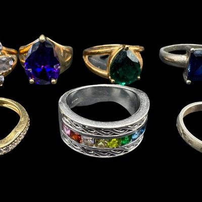 Sale Photo Thumbnail #592: Includes amethyst, London blue topaz, and more. Some of these have a 14K gold vermeil wash. Total of seven rings. The total weight is 37.00 grams. [GG]