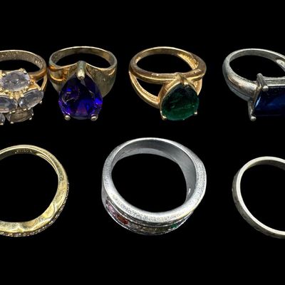 Sale Photo Thumbnail #593: Includes amethyst, London blue topaz, and more. Some of these have a 14K gold vermeil wash. Total of seven rings. The total weight is 37.00 grams. [GG]