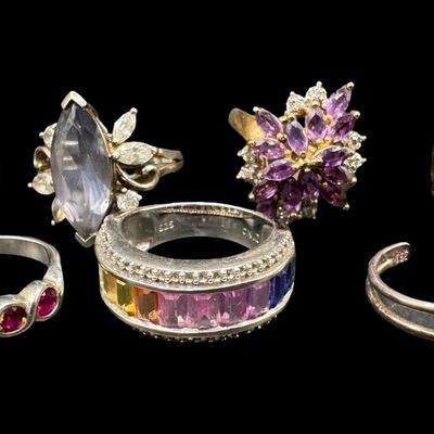 Sale Photo Thumbnail #594: Includes amethyst, tourmaline, smokey quartz, and more. Total of seven rings. Some have a 14K gold vermeil wash. The total weight is 34.43 grams. [GG]