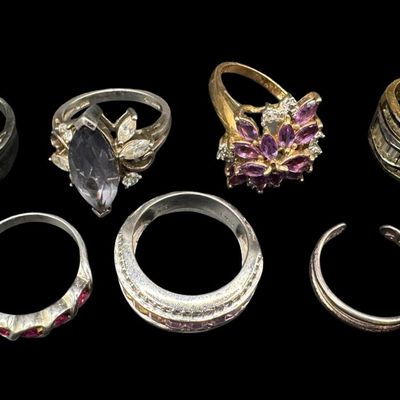 Sale Photo Thumbnail #595: Includes amethyst, tourmaline, smokey quartz, and more. Total of seven rings. Some have a 14K gold vermeil wash. The total weight is 34.43 grams. [GG]