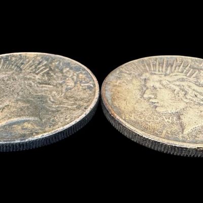 Sale Photo Thumbnail #607: Includes a 1922-S Peace dollar, and a 1924-S Peace dollar. Total of two ungraded coins. The silver content is 90%. [PM]