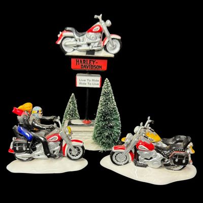 Sale Photo Thumbnail #640: From the original Snow Village Series. This retired set features a hand painted ceramic building along with detailed accessory pieces. Total of four pieces. This may or may not be complete. The separate HD sign with motorcycle on top has been repainted (p