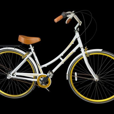Sale Photo Thumbnail #647: This is constructed of a lightweight aluminum step-through frame, with distinct gold script accents. It features front and rear hand-operated side pull caliper brakes. It is gently used, though there may be stains or pitting in places. [AG]