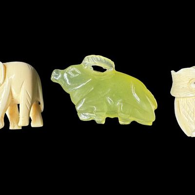 Sale Photo Thumbnail #652: Includes a jade water buffalo, an ivory owl, and an ivory elephant. Total of three pieces. The owl is ornately carved with painted eyes. Measurement of longest: 1 5/8”. **WINNING BIDDER MUST PRESENT VALID FLORIDA ID AT LOCAL PICKUP.** [DK]