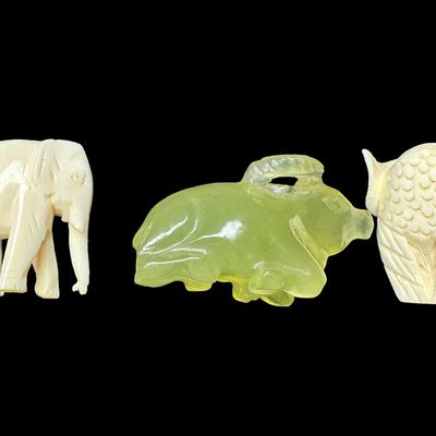 Sale Photo Thumbnail #653: Includes a jade water buffalo, an ivory owl, and an ivory elephant. Total of three pieces. The owl is ornately carved with painted eyes. Measurement of longest: 1 5/8”. **WINNING BIDDER MUST PRESENT VALID FLORIDA ID AT LOCAL PICKUP.** [DK]