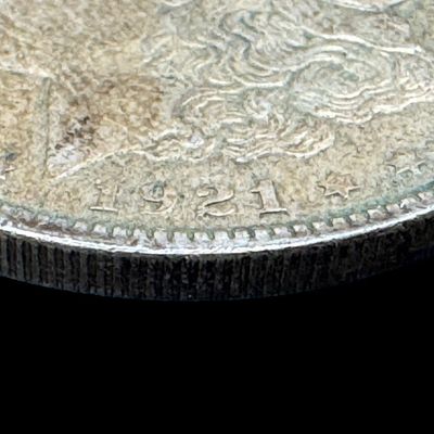 Sale Photo Thumbnail #664: This 1921-O Morgan is not graded. The silver content is 90%. [PM]