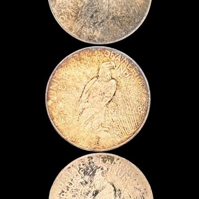 Sale Photo Thumbnail #676: Includes a 1922 Peace dollar, a 1922-D Peace dollar, and a 1922-S Peace dollar. Total of three ungraded coins. The silver content is 90%. [PM]