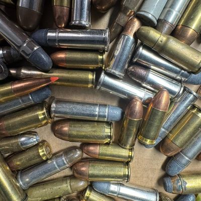 Sale Photo Thumbnail #701: Includes a wide variety of ammunition in the following calibers: .38 special, .44 mag, .30 cal, 5.56, and 9mm. Total of 100+ rounds. **NO SHIPPING ON AMMUNITION.** [GG]