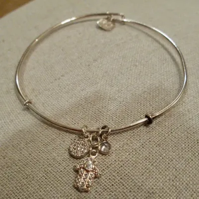 Sale Photo Thumbnail #323: Sterling silver signed 925 bangle bracelet with dangling Hamsa crystal hand and round crystal charms dangling braceletBracelet and charms are in good condition...toned and cleaned for immediate wearing.