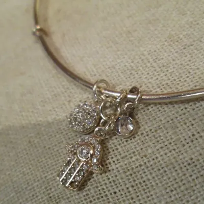 Sale Photo Thumbnail #326: Sterling silver signed 925 bangle bracelet with dangling Hamsa crystal hand and round crystal charms dangling braceletBracelet and charms are in good condition...toned and cleaned for immediate wearing.