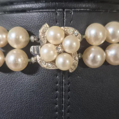 Sale Photo Thumbnail #149: Stunning Freshwater Pearl 2 strand Necklace & Pearl Earrings
> Necklace has a beautiful box closure clasp, functions properly.  Necklace is 18"long
   beautiful 2 strand. Pearls are uniform size and knotted 
> Clip on earrings to match