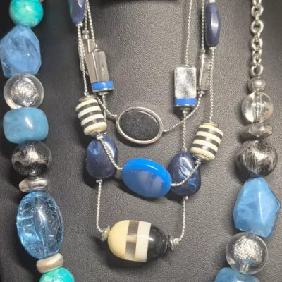 Sale Photo Thumbnail #158: Very Fashionable Jewels ~ 2 multi stone Blue Necklaces / Cuff Bracelet / Earrings  [4pcs]
> Charming Charlie double strand bead + glass beads
> chunky multi stone choker 
> hinged enamel bracelet 
> pair of pierce rhinestone earrings in blue