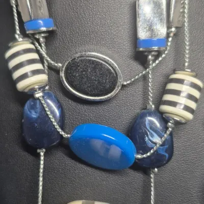 Sale Photo Thumbnail #162: Very Fashionable Jewels ~ 2 multi stone Blue Necklaces / Cuff Bracelet / Earrings  [4pcs]
> Charming Charlie double strand bead + glass beads
> chunky multi stone choker 
> hinged enamel bracelet 
> pair of pierce rhinestone earrings in blue