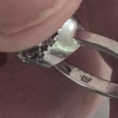 Sale Photo Thumbnail #177: Sterling Engagement Ring w/ CZ white zircon [ size 8.25 ]
Marked CFJ , located in Saginaw , Tx 1983.
Ring has a center CZ White Zircon in a halo setting
excel. condition,  no scuffs to naked eye