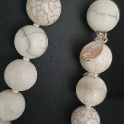 Sale Photo Thumbnail #183: Chico's Natural Stone Necklace ~ 30" & matching earrings
8mm round cream stones, knotted and single length [no clasp]
single drop earrings to match as a set
207gr weight