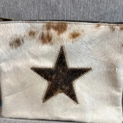 Sale Photo Thumbnail #194: Star Cowhide Zipper Bags Coin, Cosmetic, Travel Purse that is genuine cowhide front and back [solid brown[

with full zipper. Unlined