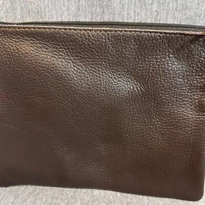 Sale Photo Thumbnail #195: Star Cowhide Zipper Bags Coin, Cosmetic, Travel Purse that is genuine cowhide front and back [solid brown[

with full zipper. Unlined