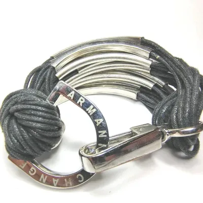 Sale Photo Thumbnail #326: VINTAGE ARMANI EXCHANGE BRACELET LEATHER AND GOLD TONE METAL ARCH SHAPED
excellent condition......pre owned, no damage, no stains.