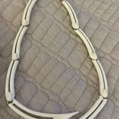 Sale Photo Thumbnail #334: A striking, and rare 1970s vintage white enamel necklace, by Monet.This beautiful piece features the original extender.Signed Monet on the reverse of the centre piece, and on both clasps. good condition, with all enamel in tact.