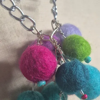 Sale Photo Thumbnail #268: Custom Wool Fiber NECKLACE ~ creator made> each wool ball is hand dyed and rolled
> balls are on stainless stems with custom bead tips> necklace is stainless to prevent allergies and mold
> size: 12"long Ball Pendant: 4"h x 3"W
