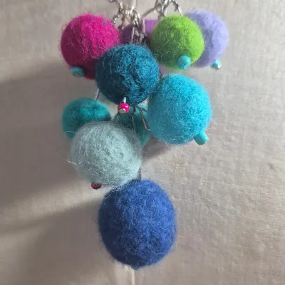 Sale Photo Thumbnail #269: Custom Wool Fiber NECKLACE ~ creator made> each wool ball is hand dyed and rolled
> balls are on stainless stems with custom bead tips> necklace is stainless to prevent allergies and mold
> size: 12"long Ball Pendant: 4"h x 3"W