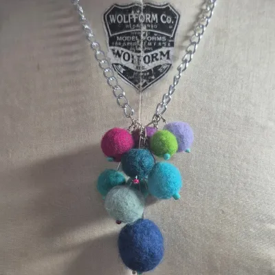 Sale Photo Thumbnail #266: Custom Wool Fiber NECKLACE ~ creator made> each wool ball is hand dyed and rolled
> balls are on stainless stems with custom bead tips> necklace is stainless to prevent allergies and mold
> size: 12"long Ball Pendant: 4"h x 3"W