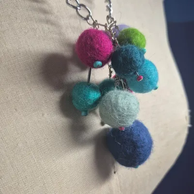 Sale Photo Thumbnail #267: Custom Wool Fiber NECKLACE ~ creator made> each wool ball is hand dyed and rolled
> balls are on stainless stems with custom bead tips> necklace is stainless to prevent allergies and mold
> size: 12"long Ball Pendant: 4"h x 3"W