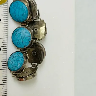 Sale Photo Thumbnail #13: Bold Southwestern style meets vivid blue matrix stones in this substantial link bracelet, featuring large round turquoise-look cabochons set in a silver-tone articulated design that makes a striking statement whether worn alone or layered with other favor