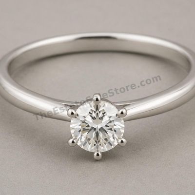 Sale Photo Thumbnail #8: Classic white-gold solitaire ring set with one round brilliant diamond-style stone in a six-prong mounting. Slender polished band and low, wearable profile. Marked 14K; approximate ring size 6.75 and estimated gross weight 2.7 grams. Very good cosmetic co