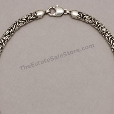 Sale Photo Thumbnail #24: Bold sterling silver necklace constructed with tightly woven Byzantine-style links and finished with a large lobster clasp. Approximate wearable length 20 inches and estimated gross weight 48.5 grams. Marked 925 near the clasp. Light overall patina with n