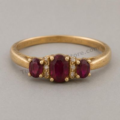 Sale Photo Thumbnail #35: Yellow-gold ring set with three oval ruby-style stones in a graduated prong setting, accented by small diamond-style stones along the shoulders. Marked 14K; approximate ring size 7.5 and estimated gross weight 4.9 grams. The band shows fine scratches and 