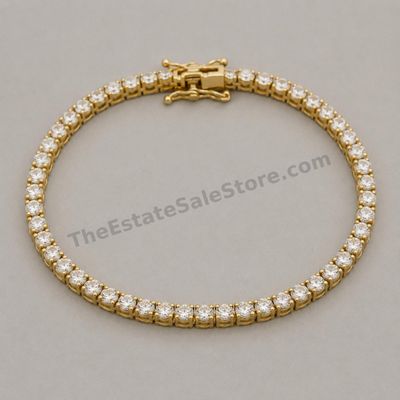 Sale Photo Thumbnail #41: Flexible yellow-gold line bracelet set with approximately forty-two round diamond-style stones in individual four-prong links. Approximate wearable length 7 inches with box clasp and twin safety catches. Marked 14K; estimated gross weight 10.7 grams. Good