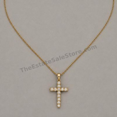 Sale Photo Thumbnail #52: Yellow-gold cross pendant set with eleven round diamond-style stones and suspended from an 18-inch fine curb chain. Pendant and chain marked 14K; estimated combined gross weight 4.8 grams. Light scratches are visible on the reverse of the pendant.