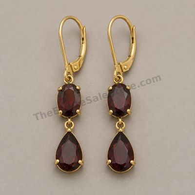 Sale Photo Thumbnail #53: Pair of articulated yellow-gold drop earrings, each set with one oval and one pear-shaped deep-red garnet-style stone. Lever-back closures appear functional. Marked 14K; approximate drop length 1.5 inches and estimated combined gross weight 6.1 grams. Lig