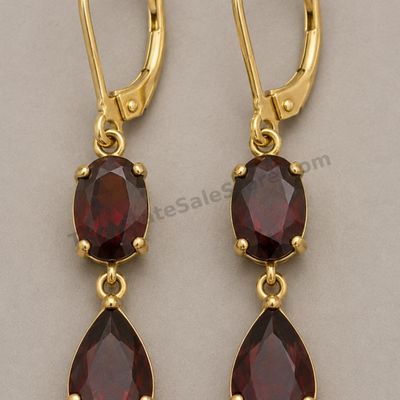 Sale Photo Thumbnail #54: Pair of articulated yellow-gold drop earrings, each set with one oval and one pear-shaped deep-red garnet-style stone. Lever-back closures appear functional. Marked 14K; approximate drop length 1.5 inches and estimated combined gross weight 6.1 grams. Lig