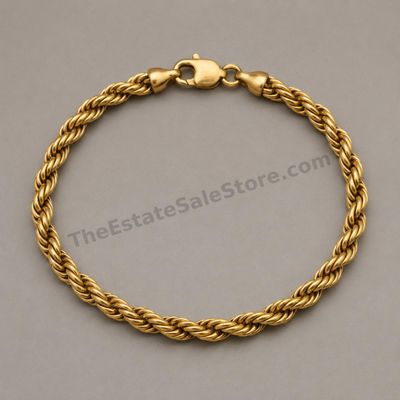Sale Photo Thumbnail #57: Substantial yellow-gold rope-link bracelet finished with a lobster clasp. Approximate wearable length 8 inches and width 6 mm; marked 14K; estimated gross weight 16.9 grams. Moderate surface scuffs and slightly darkened recesses provide a naturally worn a