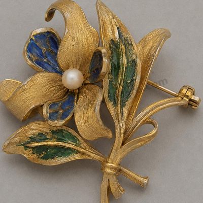 Sale Photo Thumbnail #76: Vintage yellow-gold floral brooch formed as textured leaves and petals with blue and green enamel-style accents and a small pearl-style center. Marked 750; approximate width 2 inches and estimated gross weight 11.8 grams. Minor enamel chips and patina are