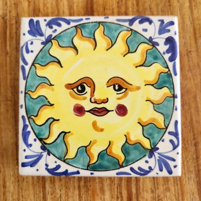 HAND-PAINTED CERAMIC SUN FACE TILE