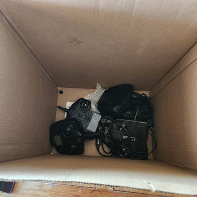 BOX LOT OF RC RADIO TRANSMITTERS AND CONTROLLERS