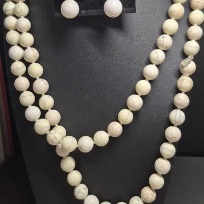 Sale Photo Thumbnail #91: Chico's Natural Stone Necklace ~ 30" & matching earrings
8mm round cream stones, knotted and single length [no clasp]
single drop earrings to match as a set
207gr weight