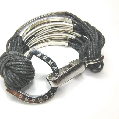 Sale Photo Thumbnail #105: VINTAGE ARMANI EXCHANGE BRACELET LEATHER AND GOLD TONE METAL ARCH SHAPED
excellent condition......pre owned, no damage, no stains.
