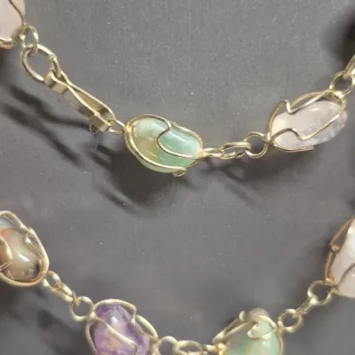 Sale Photo Thumbnail #187: Multi Gemstone, Amethyst, jade, agate, ~ gold gilt wire wrap Vintage Necklace & Cloisonne Earrings
> necklace is 14" long closed with lobster claw clasp
> 2 pair of Cloisonne earrings w/ clasp backs
All in very fine condition